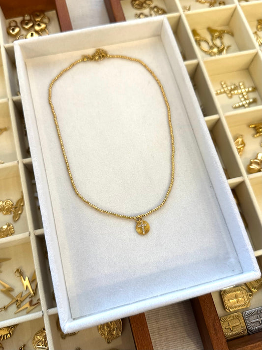 Gold Beaded + Cross